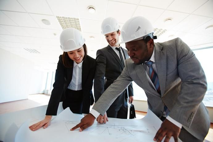Engineers reviewing construction drawings